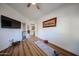 Bedroom featuring laminate flooring and an open doorway leading to the living spaces at 15225 N 100Th St # 1185, Scottsdale, AZ 85260