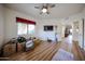 Bedroom space with laminate flooring, a ceiling fan, and one large window at 15225 N 100Th St # 1185, Scottsdale, AZ 85260