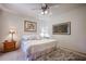Bright bedroom with ceiling fan, decorative artwork, and fluffy rug creates a peaceful atmosphere at 15225 N 100Th St # 1185, Scottsdale, AZ 85260