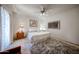 Comfortable bedroom with soft lighting, neutral decor, ceiling fan, and plush rug for a cozy retreat at 15225 N 100Th St # 1185, Scottsdale, AZ 85260