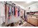 Walk-in closet with ample hanging space, shelving, and organized storage solutions, perfect for wardrobe management at 15225 N 100Th St # 1185, Scottsdale, AZ 85260
