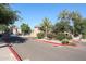 Welcoming entrance to the community with lush landscaping and secure gate at 15225 N 100Th St # 1185, Scottsdale, AZ 85260