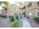 The exterior of the building features well-maintained landscaping and a cozy atmosphere at 15225 N 100Th St # 1185, Scottsdale, AZ 85260