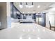 Bright kitchen featuring blue cabinets, stainless steel appliances, and stylish pendant lighting at 15225 N 100Th St # 1185, Scottsdale, AZ 85260