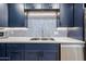 Close-up of a sleek kitchen with stone countertops and stainless steel sink at 15225 N 100Th St # 1185, Scottsdale, AZ 85260