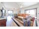 Open living area featuring modern furniture, natural light, and access to an outdoor patio at 15225 N 100Th St # 1185, Scottsdale, AZ 85260