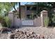 The Villages North community signage with rock accents and lush greenery at 15225 N 100Th St # 1185, Scottsdale, AZ 85260