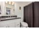 Bathroom with a white vanity, modern faucet, and framed mirror at 1583 N Constellation Ct, Gilbert, AZ 85234