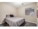 Comfortable bedroom with soft lighting, cozy carpet, and a serene atmosphere for restful nights and peaceful mornings at 1583 N Constellation Ct, Gilbert, AZ 85234