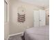 Cozy bedroom featuring neutral walls, carpet, and closet space at 1583 N Constellation Ct, Gilbert, AZ 85234