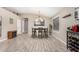 Charming dining room featuring high ceilings, a fireplace, and a stylish wine rack for the discerning homeowner at 1583 N Constellation Ct, Gilbert, AZ 85234