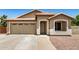 Charming single-story home showcasing a neutral color palette, well-manicured lawn, and attached garage at 1583 N Constellation Ct, Gilbert, AZ 85234