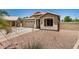 Charming single-story home showcasing a neutral color palette, well-manicured landscaping, and front yard plants at 1583 N Constellation Ct, Gilbert, AZ 85234