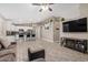 Open-concept living area showcasing neutral paint, tile floors, and fireplace entertainment center at 1583 N Constellation Ct, Gilbert, AZ 85234