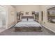 Inviting primary bedroom with a neutral color palette, plush carpet, and ample natural light from multiple windows at 1583 N Constellation Ct, Gilbert, AZ 85234