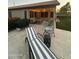 Charming patio area with comfortable seating, stylish decor, and warm string lights, ideal for relaxing evenings at 1583 N Constellation Ct, Gilbert, AZ 85234