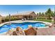 Backyard oasis featuring a sparkling pool, patio, and lush landscaping for outdoor enjoyment at 1583 N Constellation Ct, Gilbert, AZ 85234