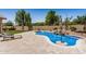 Beautiful private backyard with freeform pool and resort-style landscaping at 1583 N Constellation Ct, Gilbert, AZ 85234