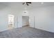 Spacious main bedroom featuring plush carpeting, ample lighting, and ensuite access at 1616 N 125Th Ln, Avondale, AZ 85392