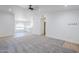 Open-concept living room featuring a light grey carpet, recessed lighting, and tile flooring at 1616 N 125Th Ln, Avondale, AZ 85392