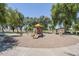 Community playground area with slides, climbing structure, and swings for  at 1616 N 125Th Ln, Avondale, AZ 85392