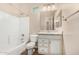 Bright bathroom with white vanity and tub/shower combination at 18108 W Cassia Way, Goodyear, AZ 85338