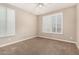 Inviting bedroom with plantation shutters and neutral carpet at 18108 W Cassia Way, Goodyear, AZ 85338