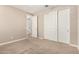 Neutral bedroom featuring carpet, ceiling fan and closet with sliding doors at 18108 W Cassia Way, Goodyear, AZ 85338
