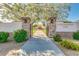 Welcoming park entrance featuring stone pillars, lush landscaping, and pathway leading to the playground at 18108 W Cassia Way, Goodyear, AZ 85338