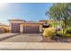 Well-maintained home with a three-car garage, xeriscape, and a block-paved driveway at 18108 W Cassia Way, Goodyear, AZ 85338