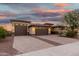 Lovely home with a three-car garage, block-paved driveway, and mature desert landscaping at 18108 W Cassia Way, Goodyear, AZ 85338