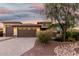 Charming home featuring a three-car garage and desert landscaping, enhancing its curb appeal at 18108 W Cassia Way, Goodyear, AZ 85338