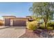 Well-maintained home with a three-car garage, xeriscape, and a block-paved driveway at 18108 W Cassia Way, Goodyear, AZ 85338