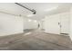 Spacious and clean garage with ample room for multiple vehicles and storage at 18108 W Cassia Way, Goodyear, AZ 85338