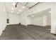 Huge bright garage featuring a door to the outside and plenty of storage at 18108 W Cassia Way, Goodyear, AZ 85338