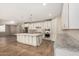 Open concept kitchen boasting a large island, granite counters, and stainless steel appliances at 18108 W Cassia Way, Goodyear, AZ 85338