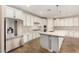 Modern kitchen featuring stainless steel appliances, granite countertops, and white cabinetry at 18108 W Cassia Way, Goodyear, AZ 85338