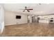 Open layout, with tile floors, connects the living room to the updated kitchen at 18108 W Cassia Way, Goodyear, AZ 85338