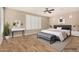 Cozy main bedroom featuring a comfortable bed, bench, neutral decor, and natural light at 18108 W Cassia Way, Goodyear, AZ 85338