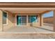 Covered patio with sliding glass door to backyard at 18108 W Cassia Way, Goodyear, AZ 85338