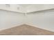 Large walk-in closet with built-in shelving and neutral carpet at 18108 W Cassia Way, Goodyear, AZ 85338