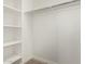 Bright walk-in closet with shelving and ample storage space, perfect for organization at 18108 W Cassia Way, Goodyear, AZ 85338