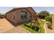 Private backyard with green lawn and playground at 20904 E Swan Dr, Queen Creek, AZ 85142