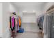 Spacious walk-in closet with organized clothing racks on both sides at 20904 E Swan Dr, Queen Creek, AZ 85142