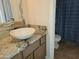 Bathroom featuring granite counters, vessel sink, framed mirror and walk-in shower at 211 Bahia E Ln, Litchfield Park, AZ 85340