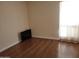 Well-lit bedroom with hardwood floors and a sleek, modern television at 211 Bahia E Ln, Litchfield Park, AZ 85340