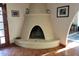 Unique fireplace featuring tile floors with traditional Southwestern design at 211 Bahia E Ln, Litchfield Park, AZ 85340