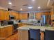 Stylish kitchen boasts stainless appliances, granite countertops, and tile flooring at 211 Bahia E Ln, Litchfield Park, AZ 85340