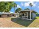 Backyard featuring a building with sliding glass doors, and a covered patio perfect for entertaining at 216 E Harmont Dr, Phoenix, AZ 85020
