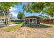 Backyard featuring a covered patio and detached structure with sliding glass doors at 216 E Harmont Dr, Phoenix, AZ 85020